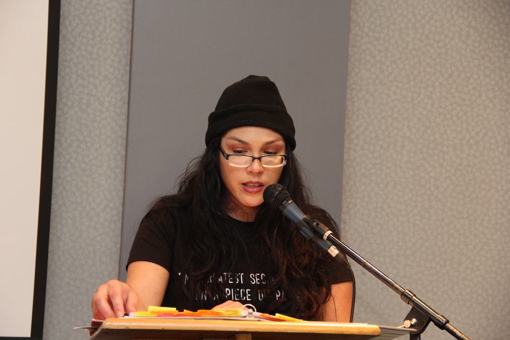 A female student reads into a microphone